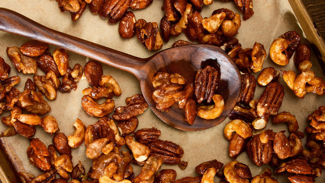 Sweet & Spicy Mixed Nuts on a baking sheet.