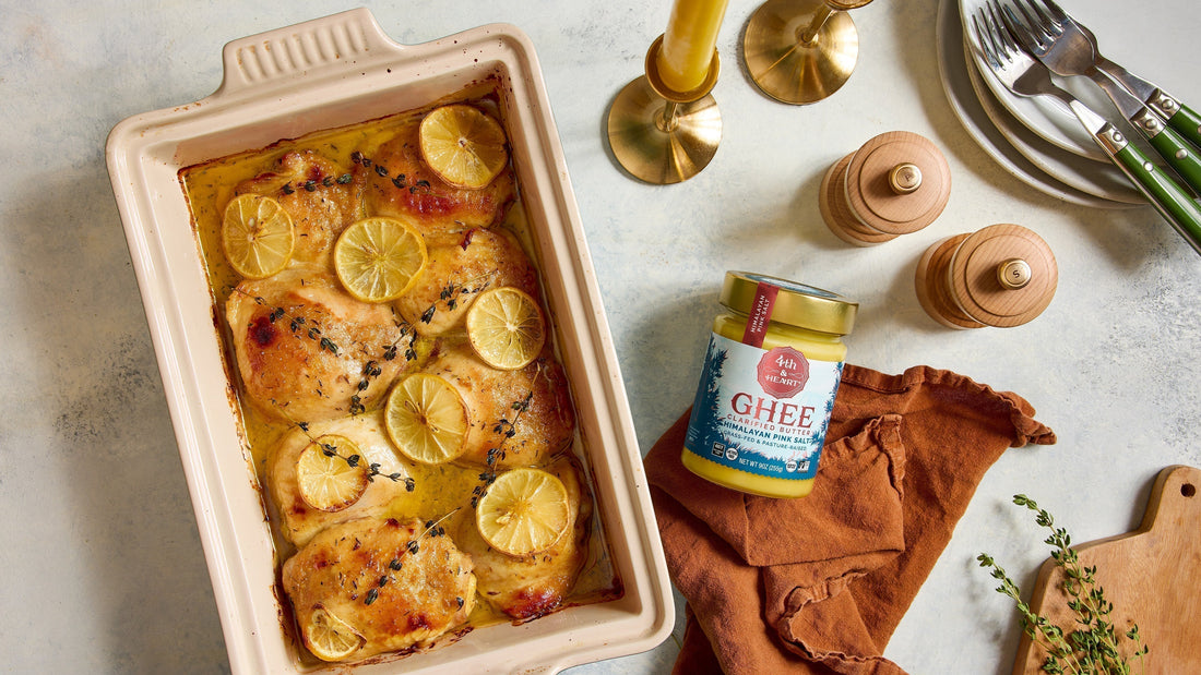 A pink casserole dish filled with Roasted Honey Mustard Chicken next to a jar of 4th & Heart ghee.