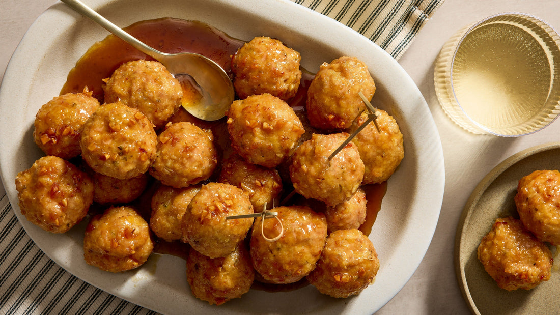 A serving platter full of Honey Glazed Chicken Meatballs.