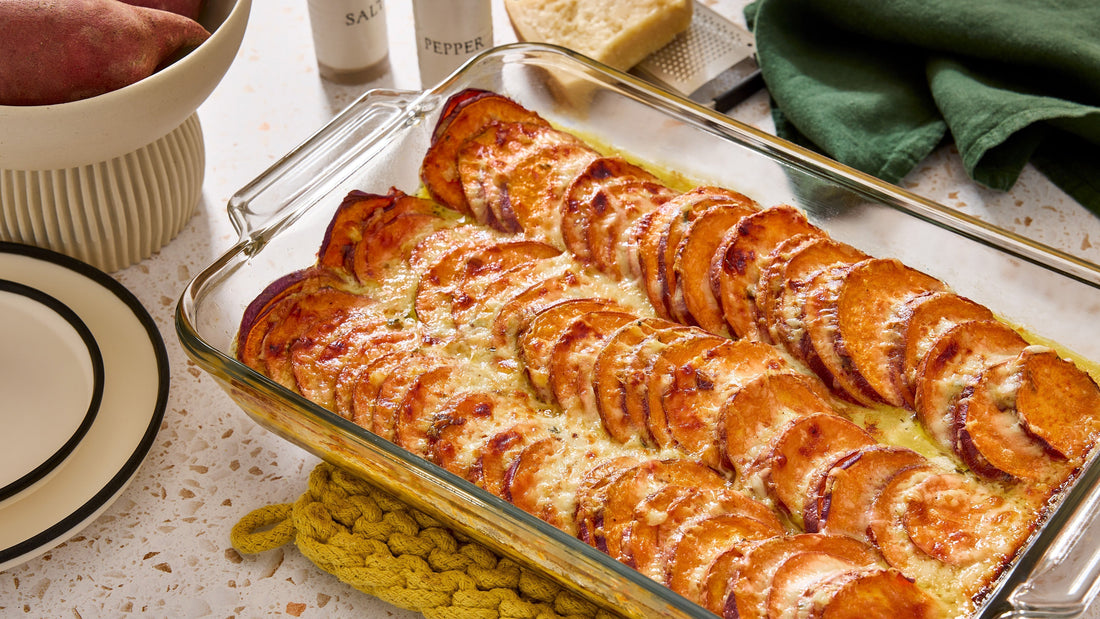 A glass casserole dish with Sweet Potato Gratin.